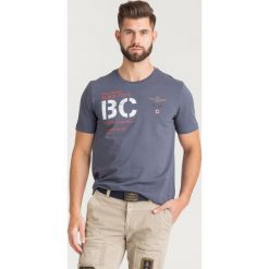 T-SHIRT Aeronautica Militare. Niebieskie t-shirty męskie Aeronautica Militare, s, z nadrukiem, z bawełny, z okrągłym kołnierzem. Za 209,00 zł.