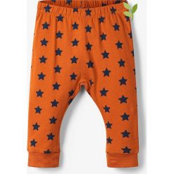 Spodnie dresowe "Ropil" w kolorze pomarańczowo-granatowym. Pomarańczowe spodnie niemowlęce name it boys, bez wzorów, z bawełny. W wyprzedaży za 29,95 zł.