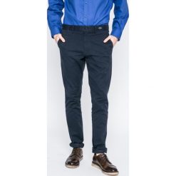 Tommy Hilfiger - Spodnie. Czerwone spodnie męskie TOMMY HILFIGER, na co dzień, bez wzorów, z elastanu, casualowe. W wyprzedaży za 249,90 zł.