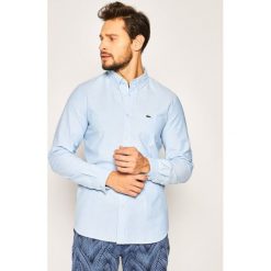 Koszula Lacoste CH4976. Niebieskie koszule męskie Lacoste, m, bez wzorów, z bawełny, casualowe, bez kołnierzyka, bez rękawów. W wyprzedaży za 279,00 zł.