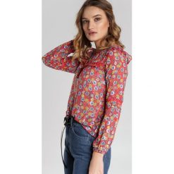 Koralowa Bluzka Alethrise. Pomarańczowe bluzki damskie Renee, s, w kwiaty, z tkaniny, z okrągłym kołnierzem, z długim rękawem. Za 79,99 zł.