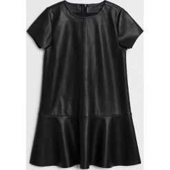 Mango Kids - Sukienka dziecięca Vera 110-164 cm. Czarne sukienki dziewczęce Mango Kids, bez wzorów, z poliesteru, z krótkim rękawem, krótkie, mini, rozkloszowane. Za 129,99 zł.