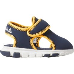 Sandały Reebok Wave Glider III (CN8614). Żółte sandały chłopięce Reebok, z materiału, bez zapięcia. Za 89,99 zł.