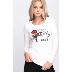 Biała Bluzka Much More. Białe bluzki damskie marki Born2be, m, z nadrukiem, z okrągłym kołnierzem, z długim rękawem. Za 19,99 zł.