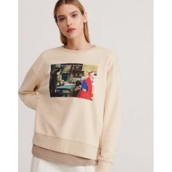 Bluza z nadrukiem Friends - Kremowy. Białe bluzy damskie Reserved, s, z nadrukiem, bez rękawów, bez kaptura. W wyprzedaży za 69,99 zł.