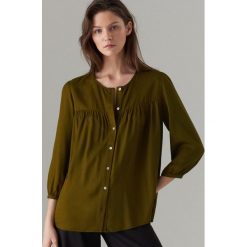Bluzka oversize z rękawami 3/4 - Khaki. Brązowe bluzki damskie Mohito, bez wzorów, bez kołnierzyka, bez rękawów. Za 99,99 zł.
