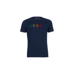 T-shirty z krótkim rękawem Guess COLORFUL G. Niebieskie t-shirty męskie Guess, s, z aplikacjami, bez kołnierzyka, krótkie. Za 159,00 zł.