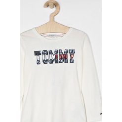 Tommy Hilfiger - Bluzka dziecięca 110-176 cm. Białe bluzki dziewczęce TOMMY HILFIGER, z nadrukiem, z bawełny, z okrągłym kołnierzem, bez rękawów, bez kaptura. W wyprzedaży za 129,90 zł.