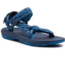 Sandały TEVA - Hurricane Xlt 2 1019390Y Delmar Blue. Niebieskie klapki damskie Teva, bez wzorów, z tworzywa sztucznego, bez obcasa. W wyprzedaży za 129,00 zł.