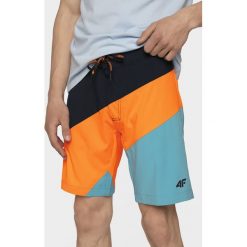 Spodenki plażowe męskie SKMT203 - pomarańcz. Spodenki i szorty męskie na lato, m, bez wzorów, z materiału. W wyprzedaży za 49,99 zł.