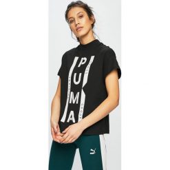 Puma - Top Xtg Graphic. Czarne bluzki damskie Puma, s, z nadrukiem, z elastanu, z okrągłym kołnierzem. W wyprzedaży za 129,90 zł.