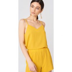 Rut&Circle Top na ramiączkach Emma - Yellow. Żółte topy damskie Rut&Circle, bez wzorów, z okrągłym kołnierzem. W wyprzedaży za 50,47 zł.