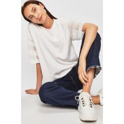 Calvin Klein - T-shirt. Białe bluzki damskie Calvin Klein, s, bez wzorów, z elastanu, z okrągłym kołnierzem. W wyprzedaży za 239,90 zł.