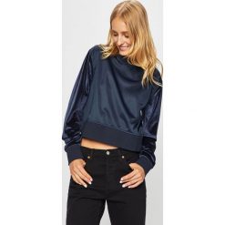 Guess Jeans - Bluza. Niebieskie bluzy damskie Guess Jeans, s, z aplikacjami, z elastanu, bez rękawów, bez kaptura. Za 259,90 zł.