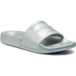 Klapki Calvin Klein Jeans Christie RE9854. Niebieskie klapki damskie Calvin Klein Jeans, bez wzorów, z jeansu, bez obcasa. W wyprzedaży za 179,00 zł.