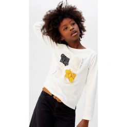 Mango Kids - Longsleeve dziecięcy Sandal 110-164 cm. Białe bluzki dziewczęce Mango Kids, z aplikacjami, z bawełny, z okrągłym kołnierzem, z krótkim rękawem, krótkie, bez kaptura. Za 59,90 zł.
