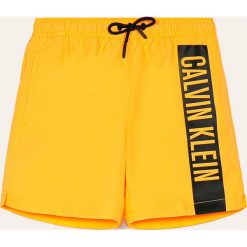 Calvin Klein - Szorty kąpielowe dziecięce 128-176 cm. Pomarańczowe spodenki chłopięce Calvin Klein, z nadrukiem, z poliesteru. Za 229,90 zł.