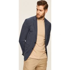 Tommy Hilfiger Tailored - Marynarka. Niebieskie garnitury męskie Tommy Hilfiger Tailored, bez wzorów, z elastanu, eleganckie. W wyprzedaży za 799,90 zł.