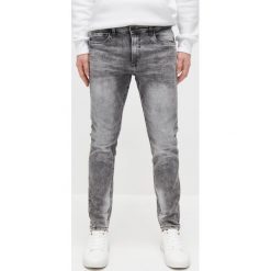 Spodnie jeansowe skinny - Jasny szary. Szare spodnie męskie Reserved, bez wzorów, z jeansu. Za 99,99 zł.