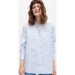 Koszula oversize z napisami -. Koszule damskie Reserved, z napisami, bez kołnierzyka, bez rękawów. Za 79,99 zł.