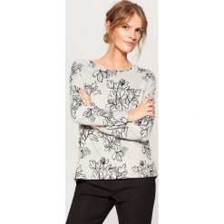 Dzianinowy sweter w kwiaty - Czarny. Czarne swetry klasyczne damskie marki Mohito, s, w kwiaty, z dzianiny. W wyprzedaży za 39,99 zł.