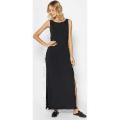 Sukienka plażowa MICHAEL Michael Kors MM3R779. Czarne sukienki damskie MICHAEL Michael Kors, na plażę, m, bez wzorów, z elastanu, bez kołnierzyka, bez rękawów. W wyprzedaży za 909,00 zł.