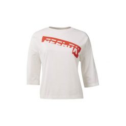 T-shirty z krótkim rękawem Reebok Sport Koszulka WOR Meet You There Graphic. Białe topy sportowe damskie marki Reebok Sport, s, bez wzorów, bez kołnierzyka, z krótkim rękawem, krótkie, bez kaptura. Za 119,00 zł.