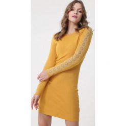 Żółta Sukienka Kareela. Żółte sukienki damskie Born2be, xl, z aplikacjami, z dzianiny, eleganckie, bez kołnierzyka, bez rękawów, długie, mini, dopasowane. Za 109,99 zł.