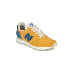 Buty New Balance U220. Żółte trampki i tenisówki damskie New Balance, bez wzorów, bez zapięcia. Za 349,00 zł.