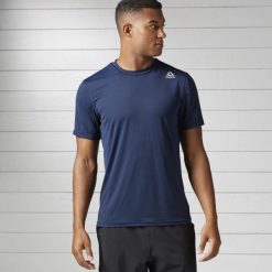 KOSZULKA MĘSKA REEBOK WORKOUT BS1406. Szare koszulki męskie Reebok, m, bez wzorów, bez kołnierzyka, bez rękawów. Za 79,00 zł.