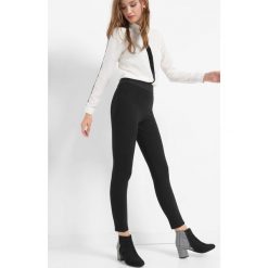 Tregginsy z wysokim stanem. Czarne legginsy marki Orsay, l, z elastanu. Za 79,99 zł.