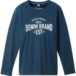 Shirt z długim rękawem i nadrukiem bonprix ciemnoniebieski z nadrukiem. Niebieskie koszule chłopięce bonprix, z nadrukiem, z materiału, sportowe, bez kołnierzyka, z długim rękawem, długie. Za 24,99 zł.