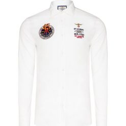 Koszula AERONAUTICA MILITARE. Niebieskie koszule męskie Aeronautica Militare, z aplikacjami, z bawełny, eleganckie, z włoskim kołnierzykiem, bez rękawów. Za 500,00 zł.