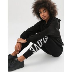 Czarno-Złote Legginsy Jynnell. Czarne legginsy damskie Born2be, s, bez wzorów. Za 39,99 zł.