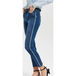 Spodnie slim z lampasami - Granatowy. Niebieskie spodnie damskie Reserved, z jeansu. Za 139,99 zł.