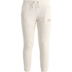 Nike Performance PANT Spodnie treningowe light bone heather/light bone. Czarne spodnie chłopięce marki Nike Performance, z bawełny. Za 169,00 zł.