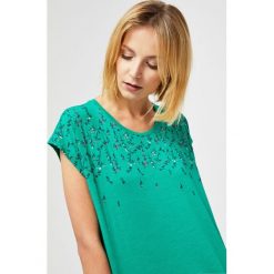 Bluzka oversize z nadrukiem. Bluzki damskie Moodo, s, z nadrukiem, bez kołnierzyka, bez rękawów. Za 24,99 zł.