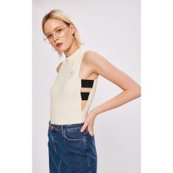 Reebok Classic - Top. Białe topy damskie Reebok Classic, s, bez wzorów, z elastanu, z okrągłym kołnierzem. W wyprzedaży za 59,90 zł.