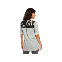 B095 Bluzka ze wstawkami w kwiaty. Białe bluzki damskie BE, xxl, z nadrukiem, z dzianiny, eleganckie, bez kołnierzyka, bez rękawów. Za 119,00 zł.