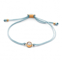 Bransoletka w kolorze szarym z pozłacaną zawieszką i kryształem Swarovski. Szare bransoletki damskie z cyrkoniami marki Ania Kruk, srebrne. W wyprzedaży za 64,95 zł.
