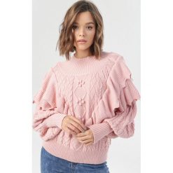 Różowy Sweter Aeve. Różowe swetry damskie Born2be, s, bez wzorów, bez rękawów, bez kaptura. Za 159,99 zł.