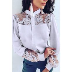 Koszula damska KORALA WHITE. Białe bluzki damskie Koszula damska KORALA WHITE, s, bez wzorów, eleganckie, bez kołnierzyka, bez rękawów. W wyprzedaży za 89,00 zł.