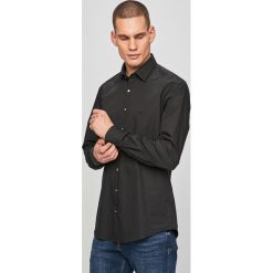 Calvin Klein - Koszula. Czarne koszule męskie Calvin Klein, bez wzorów, z elastanu, eleganckie, z klasycznym kołnierzykiem, z długim rękawem. Za 299,90 zł.