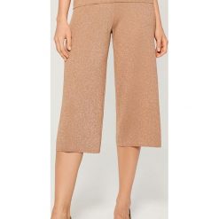 Spodnie typu culotte z lurexu - Beżowy. Spodnie damskie Mohito. W wyprzedaży za 39,99 zł.