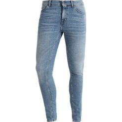 Tiger of Sweden Jeans EVOLVE Jeansy Slim Fit outcast. Niebieskie jeansy męskie marki Tiger of Sweden Jeans. Za 589,00 zł.