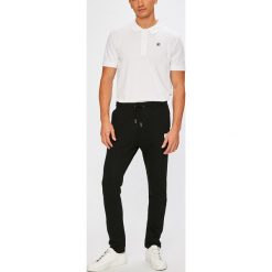 Fila - Spodnie. Czarne spodnie męskie marki Fila, na co dzień, m, bez wzorów, z bawełny, casualowe. W wyprzedaży za 149,90 zł.