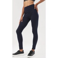 Granatowe Legginsy Briznys. Niebieskie legginsy damskie Born2be, s, bez wzorów. Za 69,99 zł.