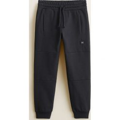 Mango Kids - Spodnie dziecięce Roland 110-164 cm. Szare spodnie chłopięce marki Mango Kids, bez wzorów, z bawełny, casualowe. Za 69,90 zł.