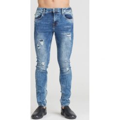 NIEBIESKIE JEANSY CHRIS SKIN TIGHT GUESS Z PRZETARCIAMI. Niebieskie jeansy męskie Guess, m, z aplikacjami. Za 294,50 zł.