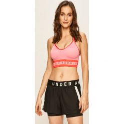 Under Armour - Biustonosz sportowy. Różowe biustonosze sportowe damskie Under Armour, xs, z nadrukiem, z elastanu. W wyprzedaży za 129,90 zł.
